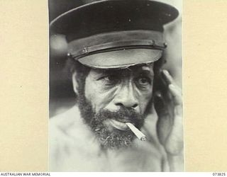 KARKAR ISLAND, NEW GUINEA. 1944-06-04. THE PORTRAIT OF A TULTUL, (CHIEF'S ASSISTANT) ON THE ISLAND. HE IS ALSO THE VILLAGE LULUAI (CHIEF), OF KENG VILLAGE. THE ISLAND IS AT PRESENT OCCUPIED BY THE ..