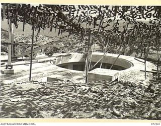 PORT MORESBY, NEW GUINEA. 1944-04-15. THE BASILISK BATTERY, FORMS PART OF THE PORT MORESBY ANTI-AIRCRAFT COASTAL DEFENCE WITH 5.25 INCH COASTAL ARTILLERY. THE COMPLETED GUN PIT CONSTRUCTED BY THE ..