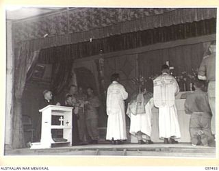 TOROKINA, BOUGAINVILLE. 1945-10-03. DR WADE, OF USA, BISHOP OF THE SOLOMON ISLANDS, KNEELING AT THE LEFT OF THE ALTAR DURING THE SOLEMN HIGH MASS OF THANKSGIVING FOR PEACE ATTENDED BY HEADQUARTERS ..