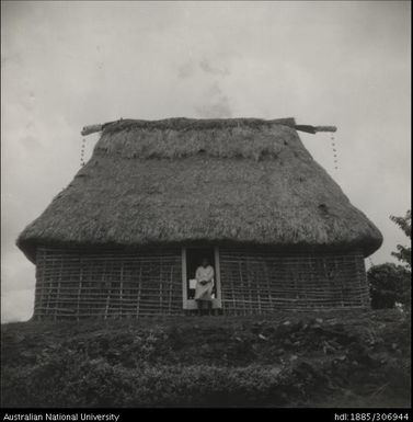 Man in the doorway of a house