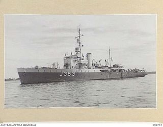 TOROKINA, BOUGAINVILLE, 1945-07-08. HMAS KIAMA (J353) IN TOROKINA HARBOUR. A NAVY CHURCH SERVICE WAS BEING CONDUCTED BY CHAPLAIN F.O. HULME-MOIR, HEADQUARTERS 2 CORPS, ON THE FORWARD DECK. ..