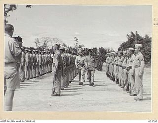 BOUGAINVILLE, 1945-06-13. THE GOVERNOR GENERAL OF NEW ZEALAND, MARSHAL OF THE ROYAL AIR FORCE, SIR CYRIL L.N. NEWALL (1), INSPECTING THE AMERICAN GUARD OF HONOUR, THE UNITED STATES MARINE CORPS, AT ..