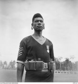 LAE, NEW GUINEA. 1944-09-12. NO. 2577 SERGEANT-MAJOR ARWESOR, BEM, ROYAL PAPUAN CONSTABULARY, A NATIVE OF THE RAI COAST, MADANG DISTRICT, WHO HAS BEEN ASSOCIATED WITH THE POLICE FORCE FOR THE PAST ..