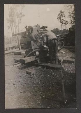 [Man Operating Water Purification Equipment]