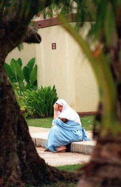 A Kurdish woman relaxes outside a family housing complex used as her temporary lodging at Andersen Air Force Base, Guam, during Operation PACIFIC HAVEN. The operation, a joint humanitarian effort conducted by the US military, entails the evacuation of over 2,400 Kurds from northern Iraq to avoid retaliation from Iraq for working with the US government and international humanitarian agencies. The Kurds will be housed at Andersen AFB, while they go through the immigration process for residence in the United States