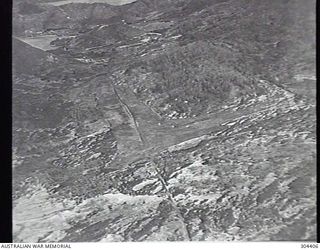 PORT MORESBY, PAPUA. 1932-09-17. AERIAL VIEW OF THE PRIMITIVE AERODROME. (NAVAL HISTORICAL COLLECTION)