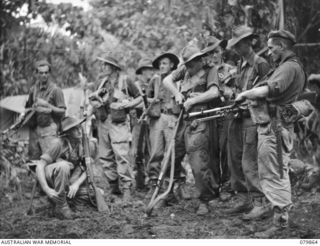 WAITAVALO AREA, WIDE BAY, NEW BRITAIN. 1945-03-16. A PATROL FROM C COMPANY 19TH INFANTRY BATTALION ABOUT TO HEAD FOR THE RIDGES BEHIND WAITAVALO PLANTATION