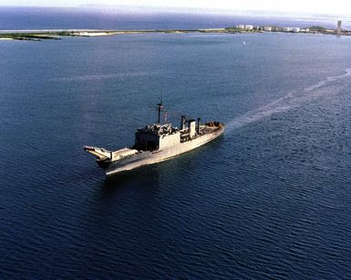 An aerial port bow view of the tank landing ship USS TUSCALOOSA (LST 1187) underway