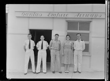 Qantas Empire Airways office staff, Port Moresby, Papua New Guinea, from right, N Noon (Traffic Officer), Miss P Gordon (Stenographer), D Treeby (Traffic Officer), N Gilmour (Traffic Officer), and P Brett (Senior Traffic Officer)