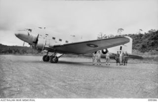 LAE, NEW GUINEA, 1945-12-23. THE RAAF DOUGLAS C47 DAKOTA AIRCRAFT WHICH CARRIED THE RIGHT HONOURABLE J. B. CHIFLEY, PRIME MINISTER OF AUSTRALIA, ON HIS TOUR OF AUSTRALIAN BATTLE AREAS