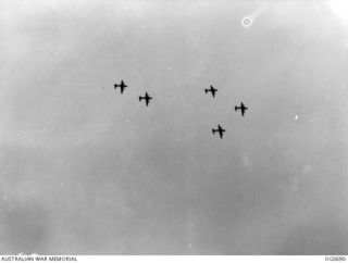 NADZAB, NEW GUINEA. C. 1944-02. B-24 LIBERATOR BOMBER AIRCRAFT OF THE 5TH AIR FORCE, US ARMY AIR FORCE, FLYING OVER NADZAB ON THE WAY TO BOMB JAPANESE POSITIONS IN NEW GUINEA