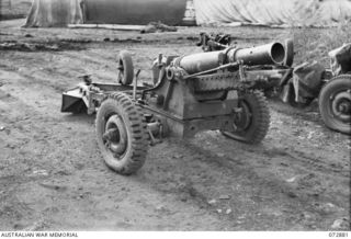 LAE, NEW GUINEA. 1944-05-03. A 25 POUNDER "SHORT" (AUSTRALIAN) MARK I GUN WHICH WAS PARACHUTED INTO THE RAMU VALLEY AND USED BY ARTILLERYMEN OF THE 2/4 FIELD REGIMENT. THE GUN, IS THE FIRST WEAPON ..