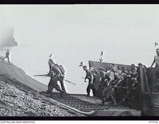 KARKAR ISLAND, NEW GUINEA. 1944-06-02. TROOPS OF 37/52ND INFANTRY BATTALION AMONG THE SECOND WAVE OF ATTACK DURING THE BEACH LANDING ON THE ISLAND. IDENTIFIED: VX139833 PRIVATE J. JONES (1); ..