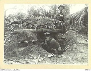 HANSA BAY-BOGIA HARBOUR AREA, NEW GUINEA. 1944-08-01. NX121824 PRIVATE J. AGNEW, BREN GUNNER (1) AND NX122272 LANCE CORPORAL A.A. MCCABE, OWEN GUNNER (2), NO. 3 SECTION, NO. 13 PLATOON, C COMPANY, ..