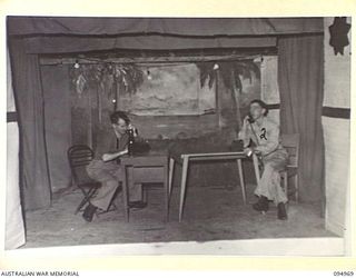 LAE AREA, NEW GUINEA. 1945-08-11. A DANCE AND STAGE PRESENTATION WAS HELD AT THE LAE BASE SUB-AREA SERGEANTS' MESS. SHOWN, A SCENE FROM THE ACT "WRONG NUMBER"