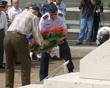 Major General (MGEN), Thomas C. Waskow, USAF, Director of Air and Space Operations, Hickam AFB, HI and a original member of the Doolittle Raiders, place a wreath the War Memorial, during a Wreath laying Ceremony at the National Memorial Cemetery of the Pacific at Honolulu, Hawaii