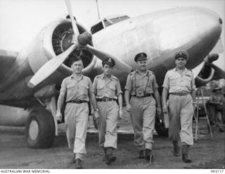 WEWAK AREA, NEW GUINEA, 1945-06-14. THE CREW OF THE RAAF LOCKHEED LODESTAR AIRCRAFT WHICH BROUGHT GENERAL SIR THOMAS A. BLAMEY, COMMANDER-IN-CHIEF, ALLIED LAND FORCES, SOUTH WEST PACIFIC AREA TO HQ ..