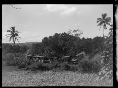 Steam train and passengers, Fiji