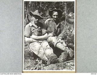 NEW GUINEA, 1943-07-27. NX90100 PRIVATE O. J. CANTOR (LEFT) AND VX43612 PRIVATE H. D. GOLDRING OF "D" COMPANY, 2/5TH BATTALION