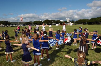 National Footbal League (NFL) cheerleaders teach dances to the children of military personnel at Naval Station Pearl Harbor, Hawaii, on Feb. 10, 2005. The NFL cheerleaders are attending Pro Bowl Festivities in Hawaii. (PHOTO by Michael Dey) (Released)