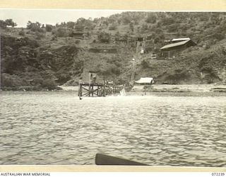 PORT MORESBY, NEW GUINEA. 1944-04-15. GEMO SECTION BATTERY VIEWED FROM THE HARBOUR SHOWING GUN INSTALLATIONS CONSTRUCTED BY THE 8TH ARMY TROOPS COMPANY, ROYAL AUSTRALIAN ENGINEERS. THE TROLLEY LINE ..