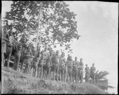 Rows of people on a river bank, Ramu or Sepik River, New Guinea, 1935 / Sarah Chinnery