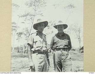 LAE, NEW GUINEA. 1944-09-08. VX114102 MAJOR V.G. SWANSON, OFFICER- IN- CHARGE (1) AND VX80977 CAPTAIN H. RAVERTY, SECOND IN CHARGE, 20TH FIELD COMPANY, WHO WERE RESPONSIBLE FOR THE BUILDING OF THE ..