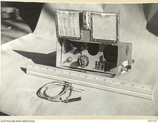 LAE, NEW GUINEA. 1944-11-27. A CAPTURED JAPANESE TYPE 94 MK VI "WALKIE-TALKIE" RADIO SET IN THE MUSEUM OF THE ASSISTANT QUARTERMASTER GENERAL (E) 1ST AUSTRALIAN ARMY (FRONT VIEW)