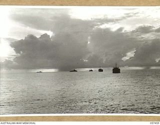 FINSCHHAFEN, NEW GUINEA, 1943-09-22. FINSCHHAFEN FORCE CONVOY APPROACHING THE COAST WITH DESTROYER ESCORT ON THE LEFT