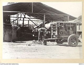 LABU, NEW GUINEA. 1944-12-18. TRANSPORT WORKSHOP PERSONNEL WORKING ON VEHICLES AT 55 PORT CRAFT COMPANY