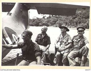 NANTAMBU, NEW BRITAIN. 1945-07-26. OFFICERS OF HEADQUARTERS 11 DIVISION IN A LAUNCH TO GO ASHORE FROM A ROYAL NEW ZEALAND AIR FORCE CATALINA. AIR TRAVEL IS AT THE MOMENT THE ONLY MOVEMENT POSSIBLE ..