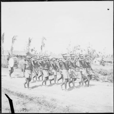 Buglers of the Police marching band with shredded palms in the background, Rabaul, New Guinea, 1937, 2 / Sarah Chinnery