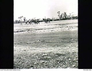 CAPE WOM, WEWAK SECTOR, NEW GUINEA, 1945-09-13. LIEUTENANT-GENERAL HATAZO ADACHI, COMMANDER OF THE JAPANESE 18TH ARMY, BEING TAKEN TO THE PRISONER OF WAR COMPOUND FOLLOWING THE SIGNING OF DOCUMENTS ..