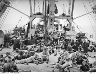 AT SEA, NEW GUINEA. 1944-10-06. TROOPS OF THE 36TH INFANTRY BATTALION RELACING ON THE AFTERDECK OF THE DUTCH TROOPSHIP, "SWARTENHONDT" ENROUTE FROM NEW GUINEA TO NEW BRITAIN. IDENTIFIED PERSONNEL ..