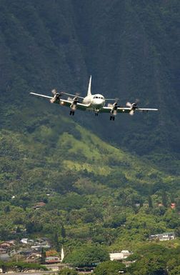 A Navy P-3C Orion patrol aircraft approaches the landing area at Marine Corps Air Station (MCAS) Kaneohe, Hawaii (HI), during exercise Rim of the Pacific (RIMPAC) 2004. RIMPAC is the largest international maritime exercise in the waters around the Hawaiian Islands. This years exercise includes seven participating nations: Australia, Canada, Chile, Japan, South Korea, the United Kingdom and the United States. RIMPAC enhances the tactical proficiency of participating units in a wide array of combined operations at sea, while enhancing stability in the Pacific Rim region