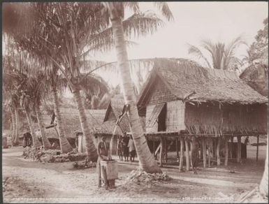 A woman collecting rainwater in the village of Maravovo, Guadalcanar, Solomon Islands, 1906 / J.W. Beattie