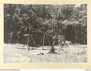 LAE, NEW GUINEA. 1944-10-18. THE END OF THE SUSPENSION BRIDGE BUILT ACROSS THE BUSU RIVER BY MEMBERS OF THE 20TH FIELD COMPANY TO CARRY A SIX INCH PIPELINE FROM THE NEW RESERVOIR TO SUPPLY WATER TO ..