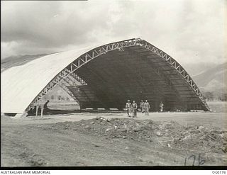 VIVIGANI, GOODENOUGH ISLAND, PAPUA NEW GUINEA. 1943-09-23. "IGLOO" HANGAR UNDER CONSTRUCTION BY MEMBERS OF NO. 7 MOBILE WORKS SQUADRON RAAF