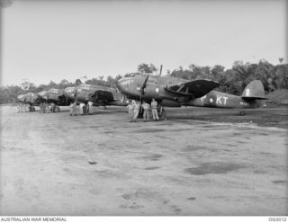 TADJI, NORTH EAST NEW GUINEA. 1945-06-27. LINE UP OF BEAUFORT BOMBER AIRCRAFT OF NO. 7 SQUADRON RAAF AND AIRCREW WHICH SERVED AS THE EYES OF THE ARMY, NAVY AND RAAF IN THE AITAPE CAMPAIGN. THE ..