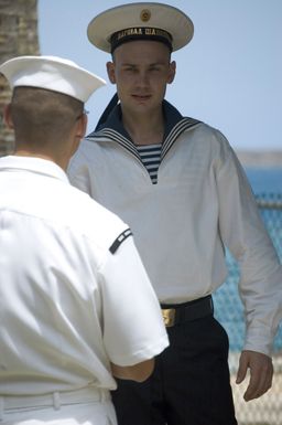 US Navy (USN) PETTY Officer (PO) Mark Filter talks to Dmitrij Doreikin, a Russian Sailor with the Russian Federated Navy (RFN) visiting the island of Guam (GU), at a Moral Welfare and Recreation-sponsored barbeque held at Gab Gab Beach at Naval Base (NB) Guam. SEAMAN Dmitrij Doreikin is a Sailor attached to one of the four RFN ships participating in PASSEX 06, an exercise designed to increase interoperability between the two navies while enhancing the strong cooperative relationship between Russia and the United States