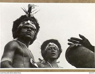 17 MILE, PORT MORESBY AREA, PAPUA, NEW GUINEA. 1943-12-25. NATIVES DRESSED FOR A DANCE TO BE HELD IN CONJUNCTION WITH THE 10TH AUSTRALIAN ADVANCED ORDNANCE DEPOT SPORTS MEETING