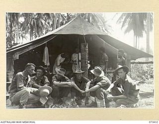 ALEXISHAFEN, NEW GUINEA. 1944-05-22. TROOPS AWAITING TREATMENT OUTSIDE THE TENT SURGERY OF C SECTION, 2/5TH DENTAL UNIT. SOME OF THE PATIENTS HAVE TRAVELLED APPROXIMATELY 5 MILES BY FOOT OWING TO ..