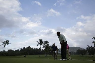 Barack Obama plays golf with Prime Minister Najib Razak, Joe Paulsen, and Mike Brush in Kaneohe Bay, Hawaii, December 24, 2014