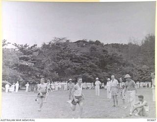 PORT MORESBY - FINISH OF 440 YARDS' RACE AT A.A.C. SPORTS. AIR FORCE 1ST AND 2ND, PORT MORESBY 3RD. RAAF SURVEY FLIGHT. (NEGATIVE BY N. TRACY)