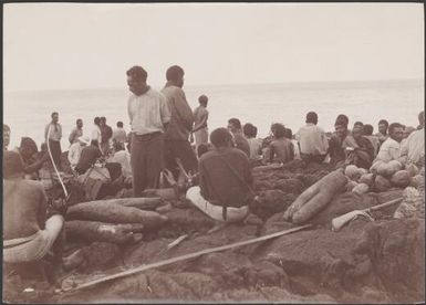 Yams and coconuts amongst crown on the landing rock at Merelava, Banks Islands, 1906 / J.W. Beattie