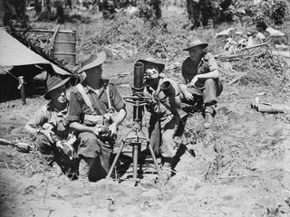 DUGUMUR BAY, NEW GUINEA. 1944-06-14. A MORTAR CREW FROM 4TH INFANTRY BATTALION. LEFT TO RIGHT: NX120990 PRIVATE (PTE) R. V. BOULDEN; W21475 PTE G. CRAVEN; NX120921 PTE D. G. HESTER AND NX156597 ..