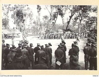 DALLMAN HARBOUR, NEW GUINEA. 1945-11-04. TROOPS OF 2/3 INFANTRY BATTALION ATTENDING A MEMORIAL SERVICE OF THANKSGIVING FOR VICTORY AND REMEMBRANCE FOR MEMBERS OF THE UNIT WHO FELL IN THE ..