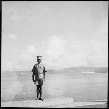 Police boy on a wharf, Rabaul Harbour, New Guinea, 1937 / Sarah Chinnery