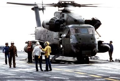 A CH-53 Sea Stallion helicopter on the flight deck of the amphibious assault ship USS GUAM (LPH 9) during Operation URGENT FURY off the coast of Grenada