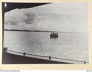 AT SEA, OFF BUIN, BOUGAINVILLE, 1945-08-20. A JAPANESE BARGE CARRYING A FLAG OF TRUCE RETURNING TO THE MAINLAND WITH A MESSAGE FOR LIEUTENANT-GENERAL M. KANDA, COMMANDER IMPERIAL JAPANESE 17 ARMY ..